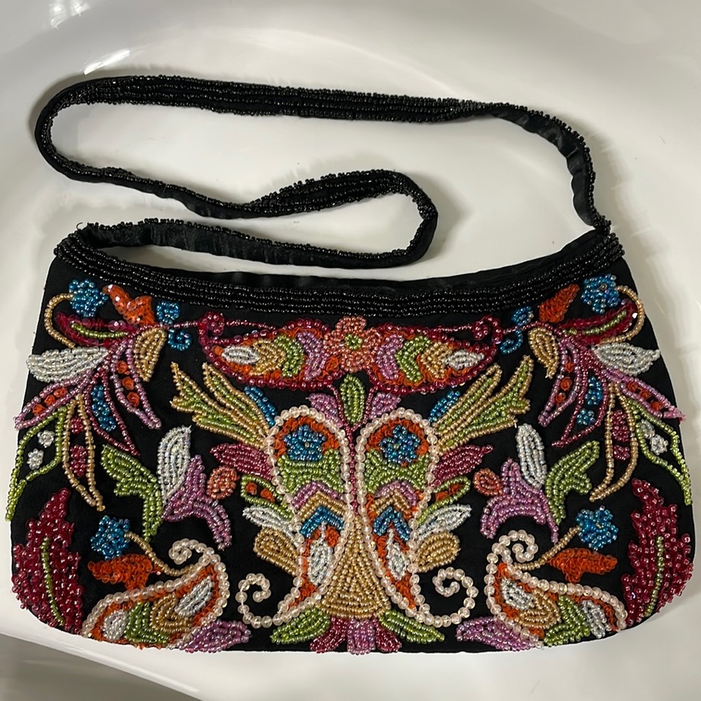 Beaded purse. New condition . Beautiful colors . 10 width / 6 length / 12 strap